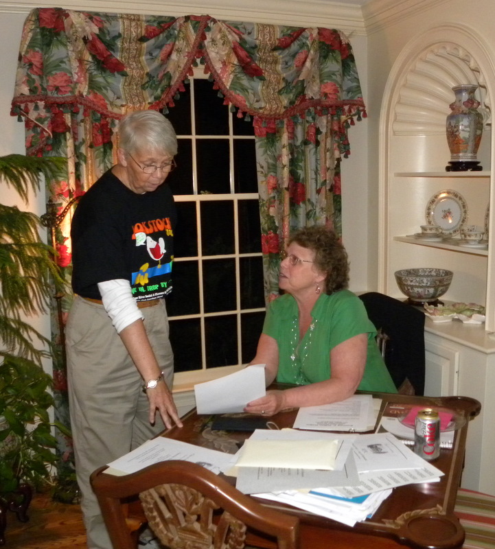 Anne Brownlee Hobgood and Lynn Moser Willamson working on registration materials